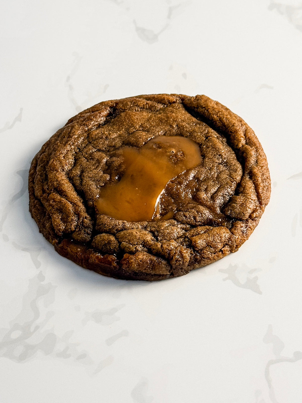 Half Three espresso toffee cookie from above at an angle, showing chewy texture and toffee