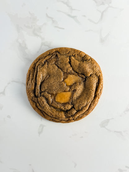 Half Three espresso toffee cookie with visible toffee pieces and a thin chewy texture