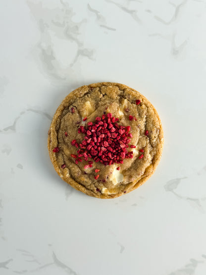 Half Three white chocolate and raspberry cookie topped with freeze-dried raspberries and white chocolate