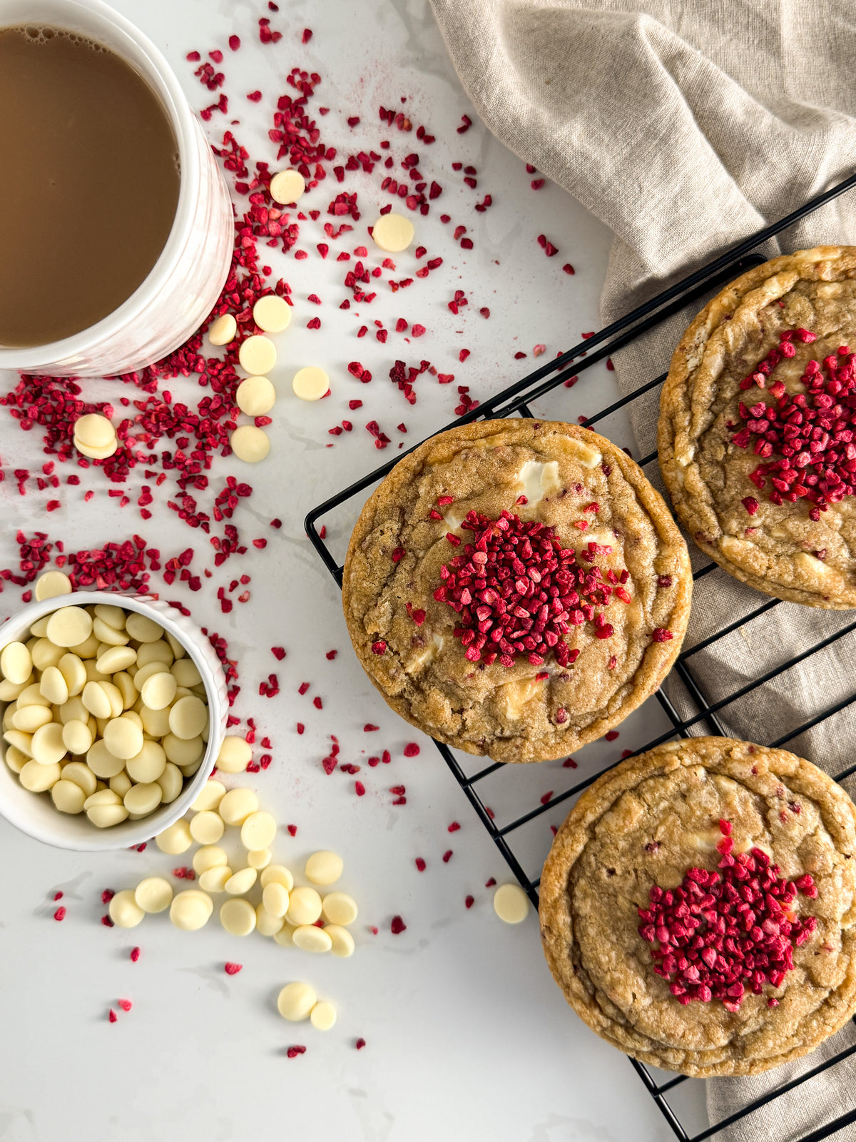 Half Three white chocolate and raspberry cookie with white chocolate callets and freeze-dried raspberries